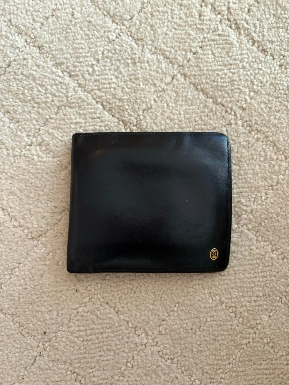 Cartier Black Leather Bi-Fold Card Holder with Gold Emblem